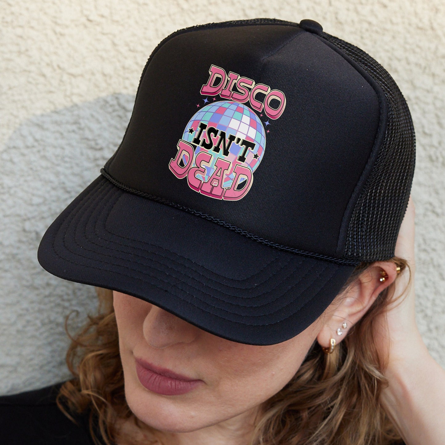 a woman wearing a disco hat with the words disco on it