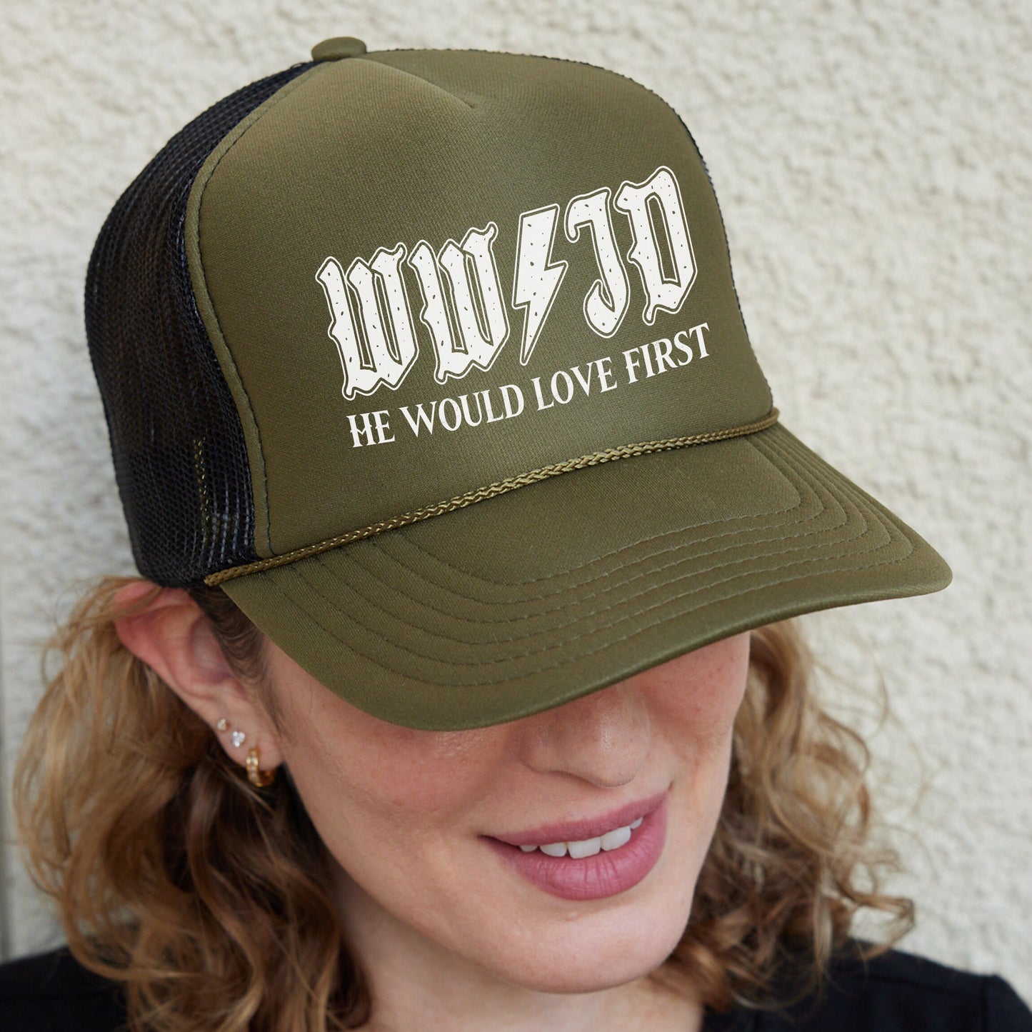 a woman wearing a trucker hat that says woo - 50 he would love first