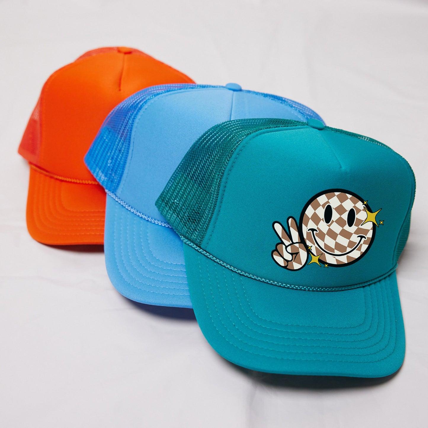 a couple of hats sitting on top of a white table