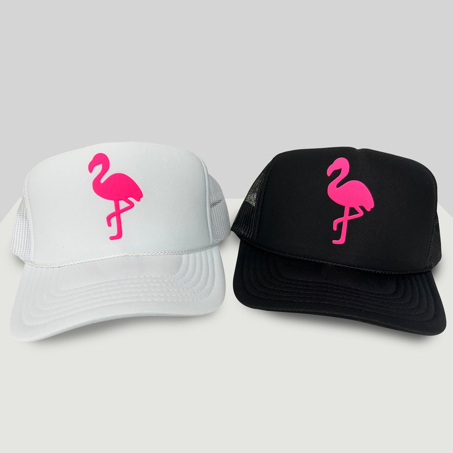 two hats with pink flamingos on them