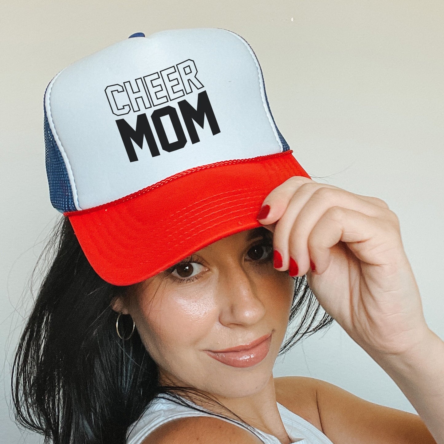 a woman wearing a red, white, and blue hat