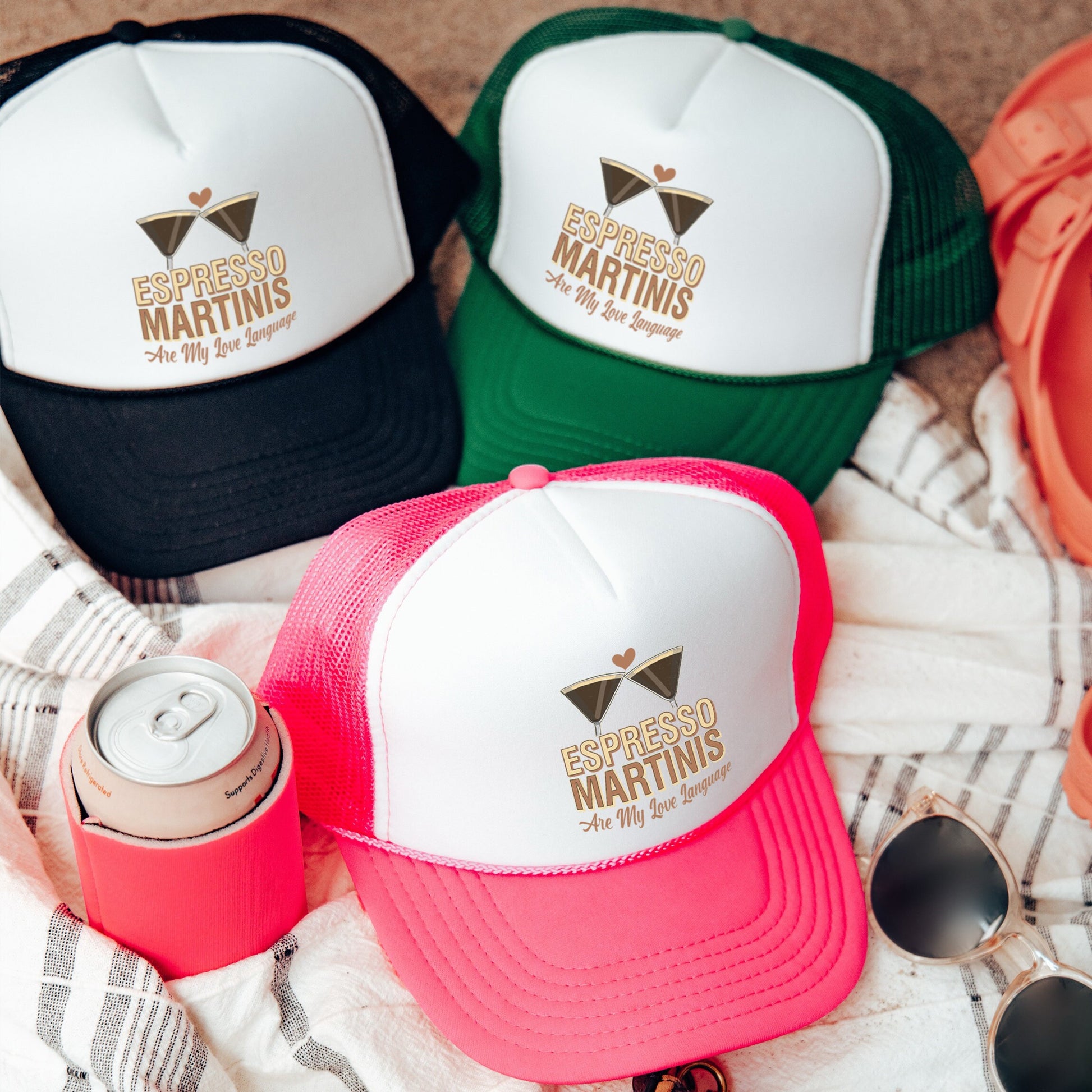 a group of hats and sunglasses on a blanket