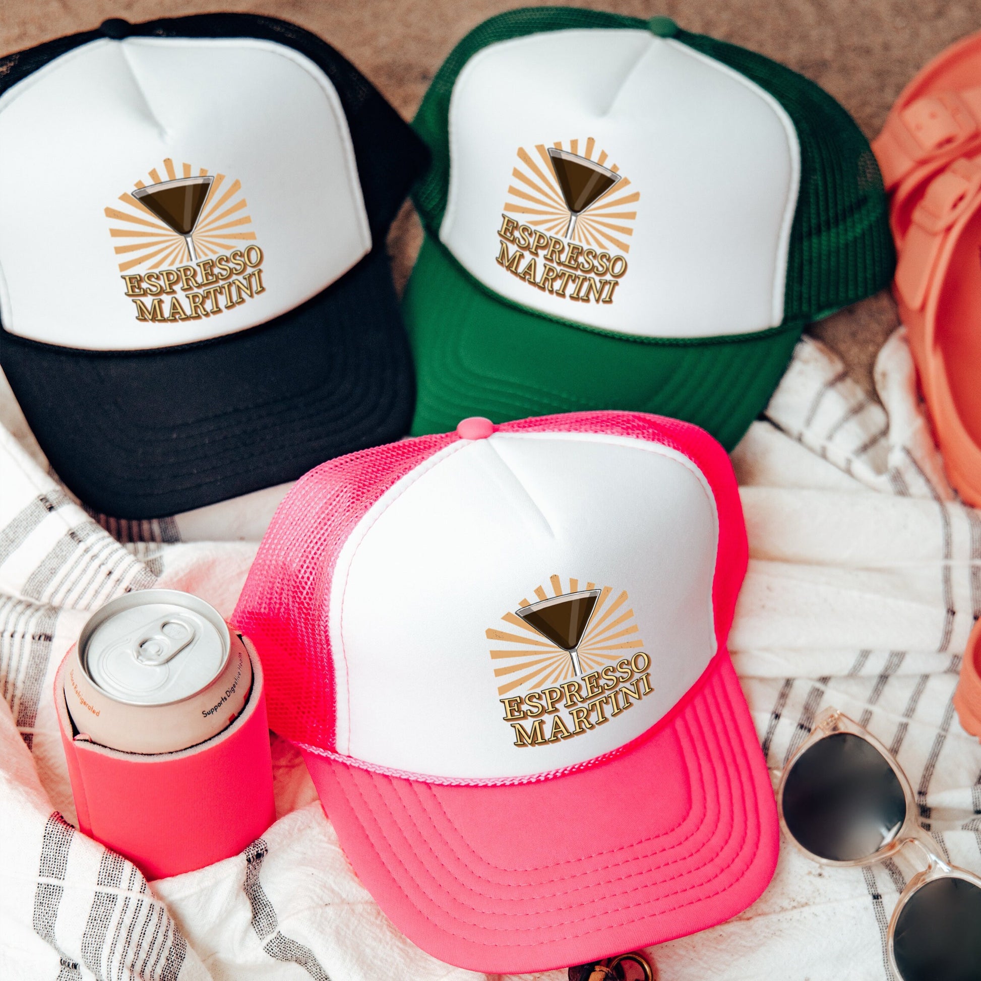 three hats and a can on a blanket