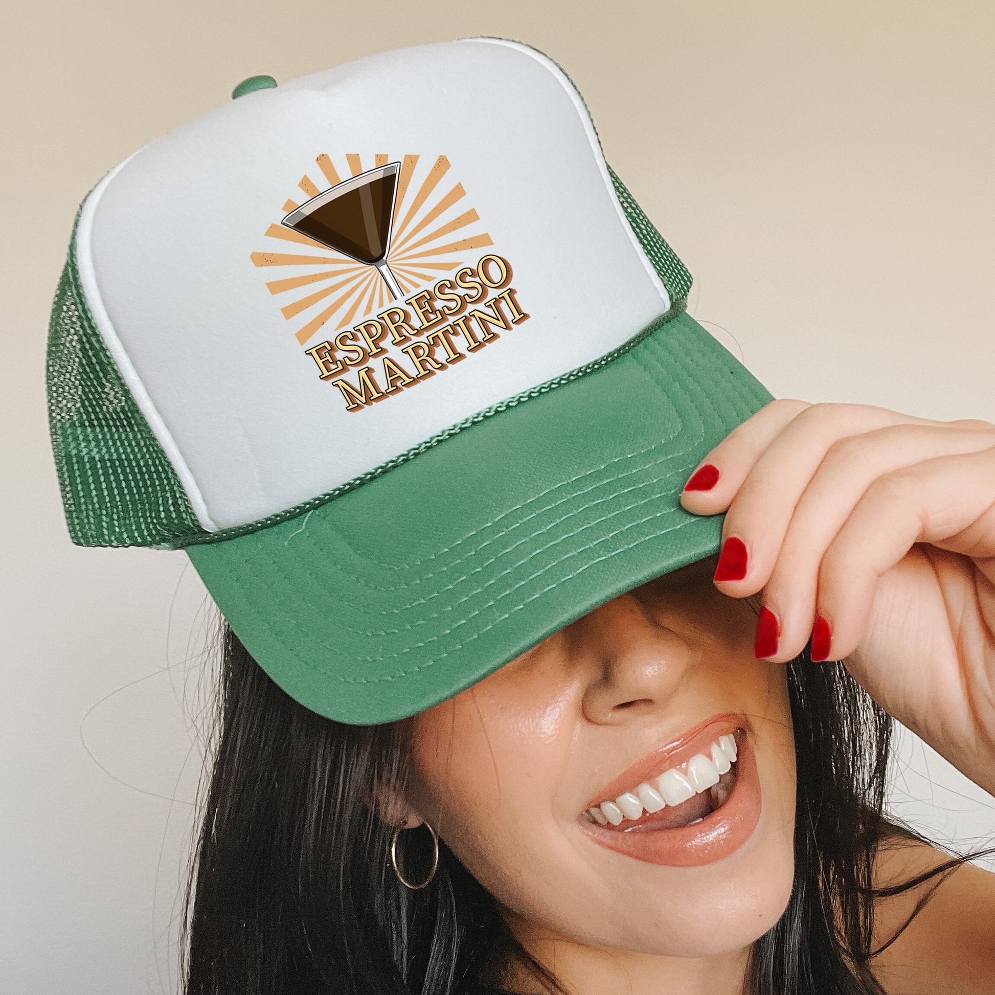 a woman wearing a green and white trucker hat