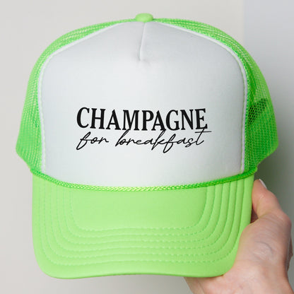 a person holding a green and white hat