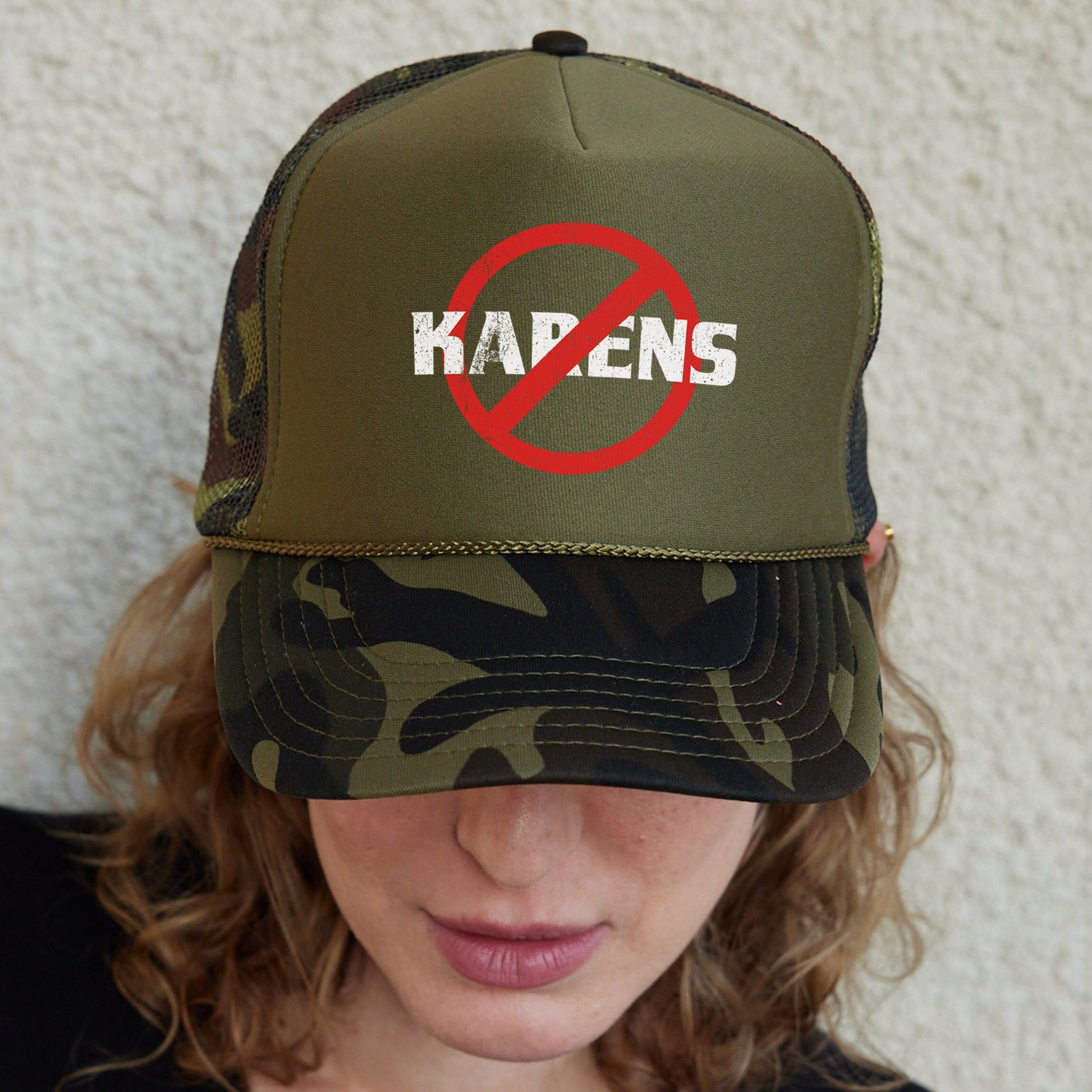 a woman wearing a hat with a no kapen sign on it