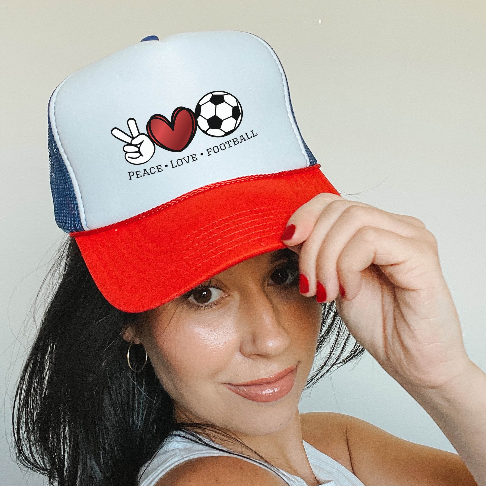 a woman wearing a red, white, and blue hat