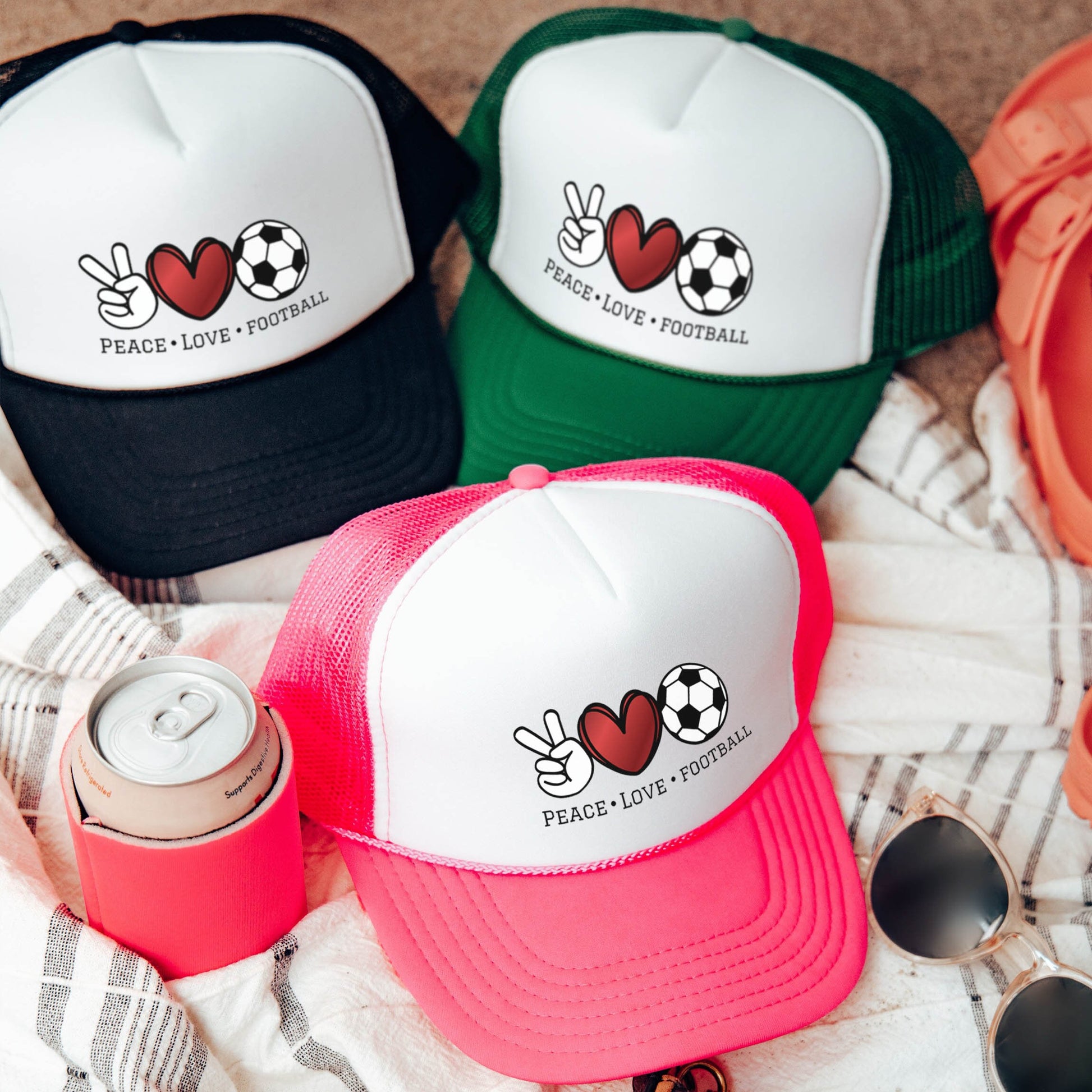 a group of hats sitting on top of a blanket