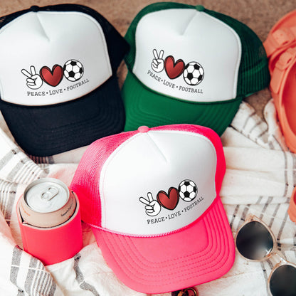 a group of hats sitting on top of a blanket
