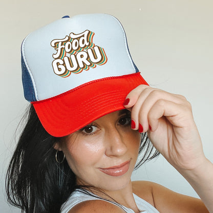 a woman wearing a red, white, and blue trucker hat