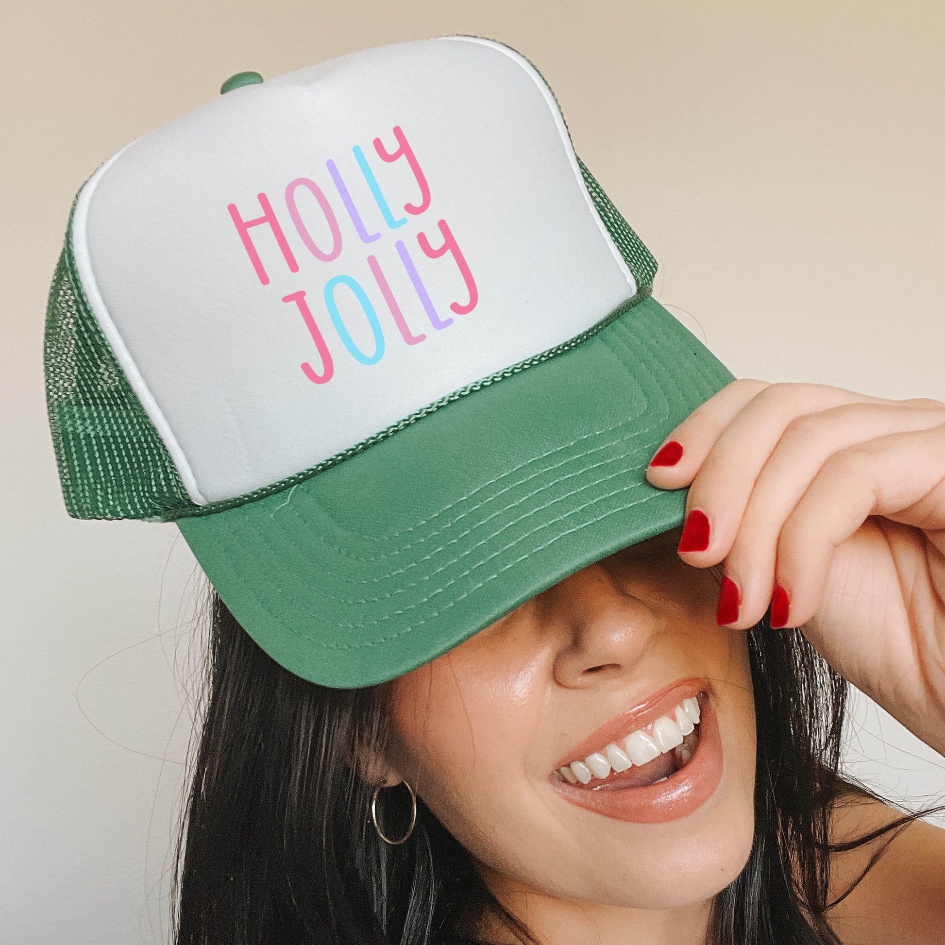 a woman wearing a green and white trucker hat