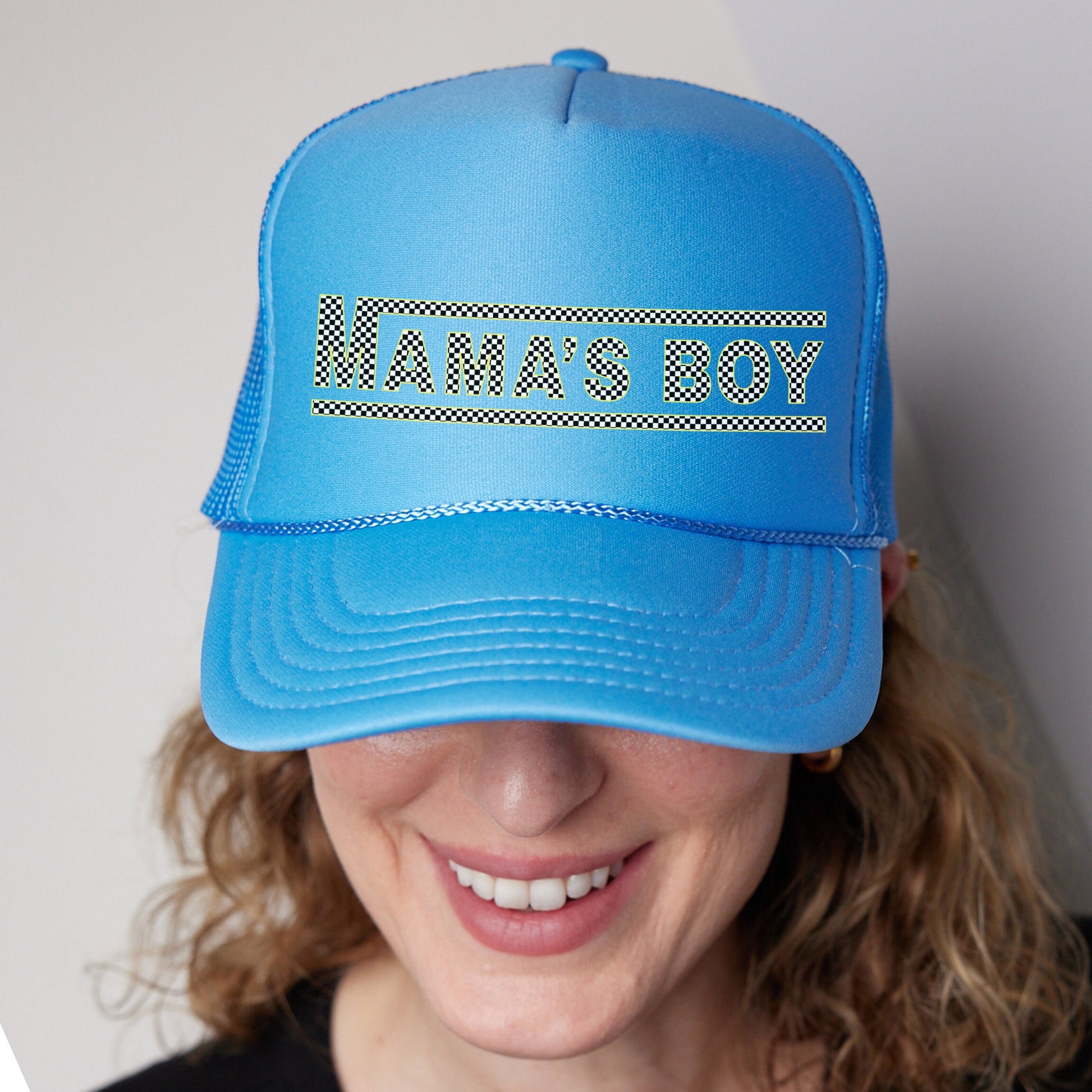 a woman wearing a blue hat with the word dance on it
