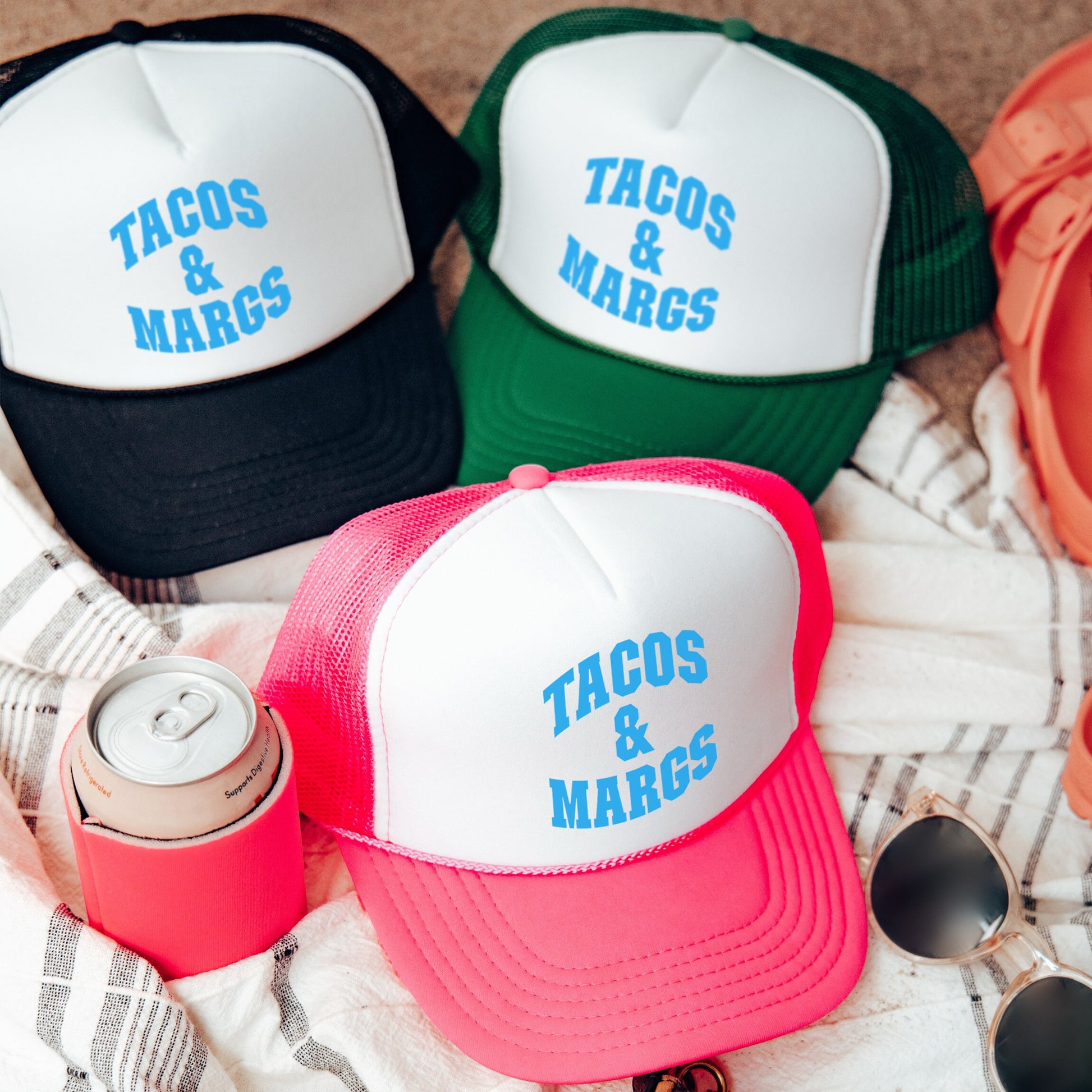 a couple of hats sitting on top of a blanket
