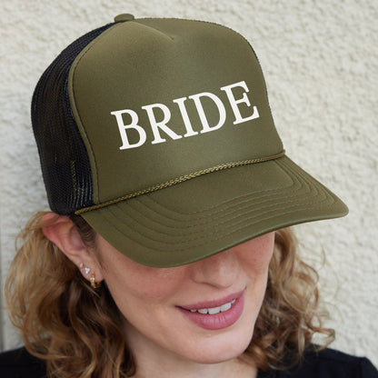 a woman wearing a trucker hat with the word bride on it