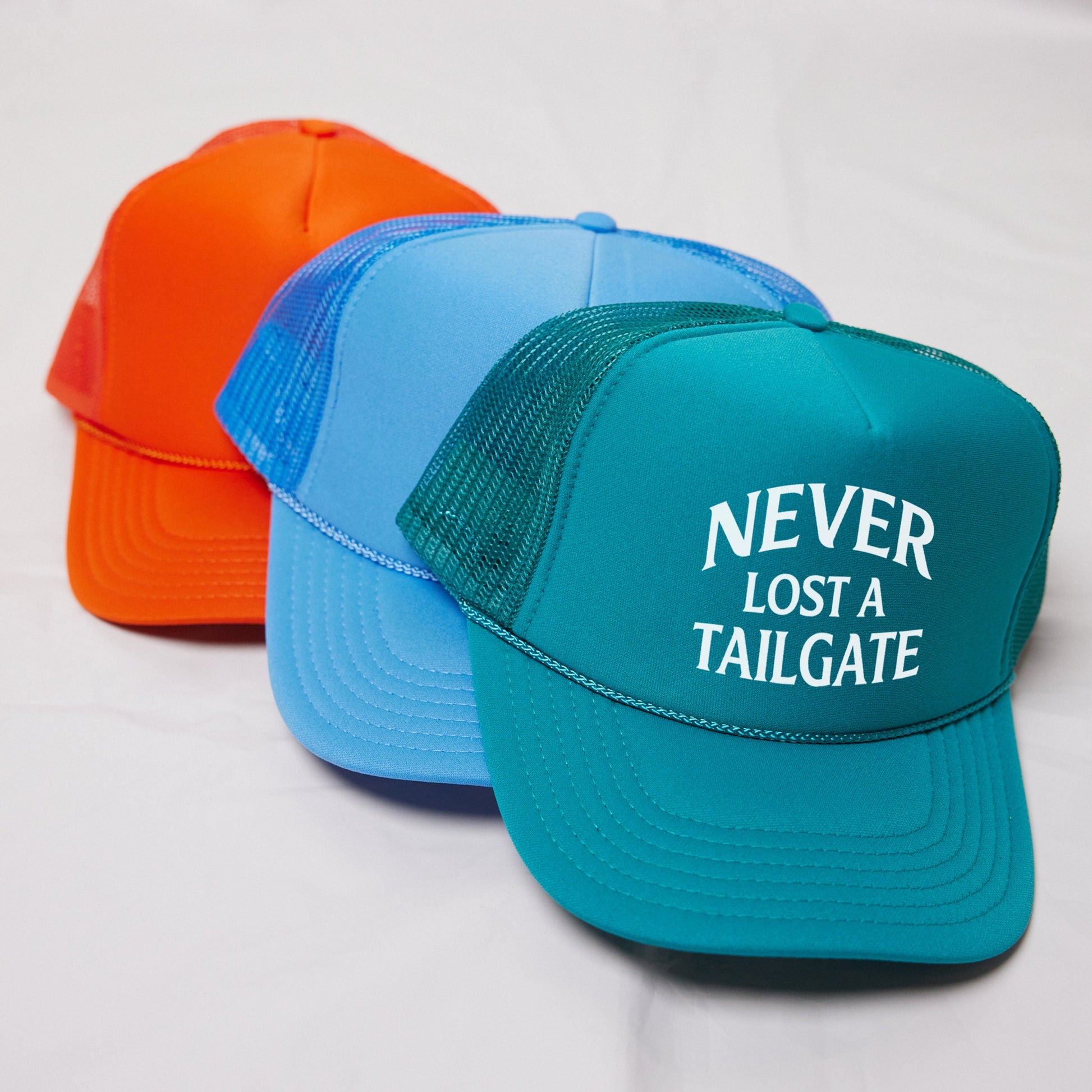 three hats that say never lost a tailgate