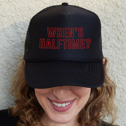 a woman wearing a hat with the words when&#39;s half time?
