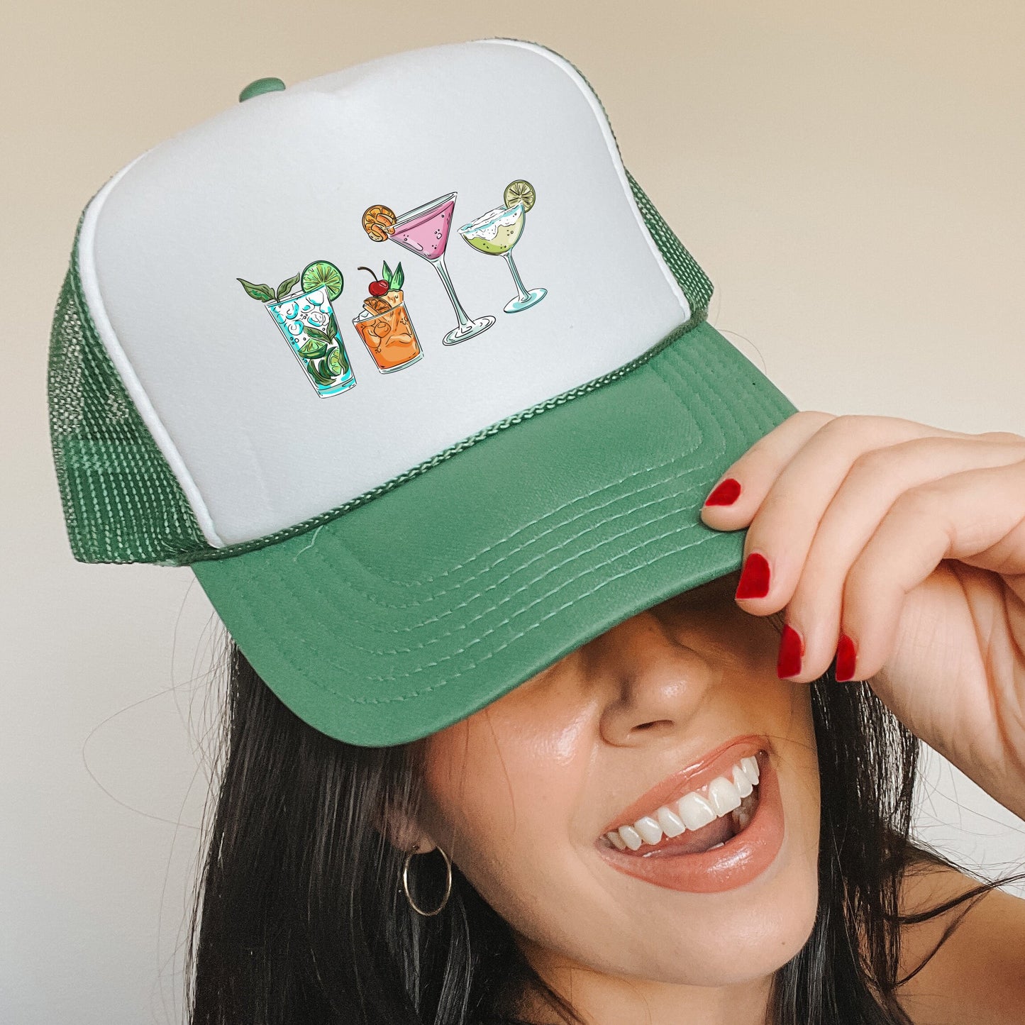 a woman wearing a green and white trucker hat