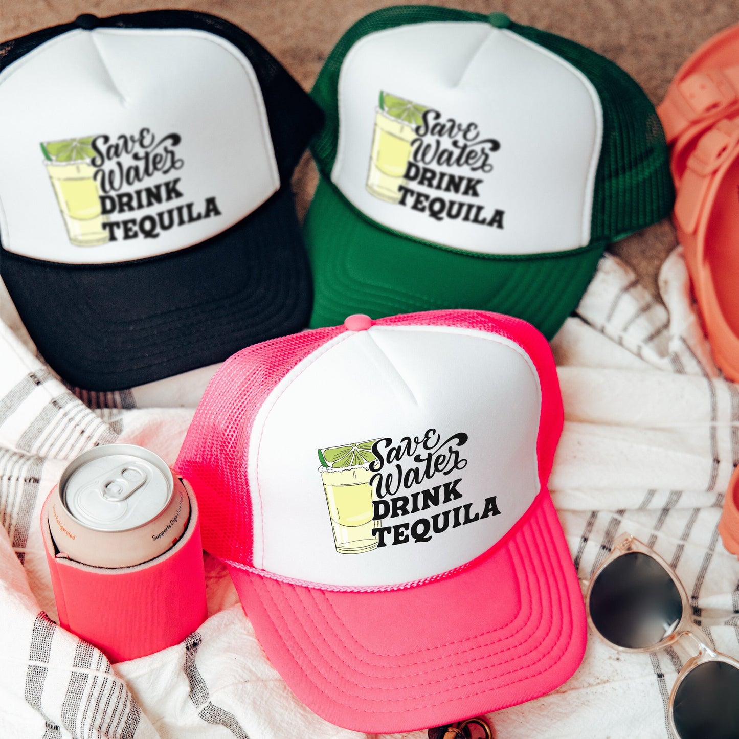 a couple of hats sitting on top of a towel