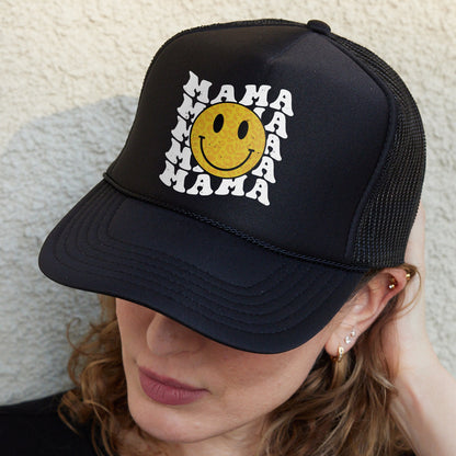 a woman wearing a hat with a smiley face on it