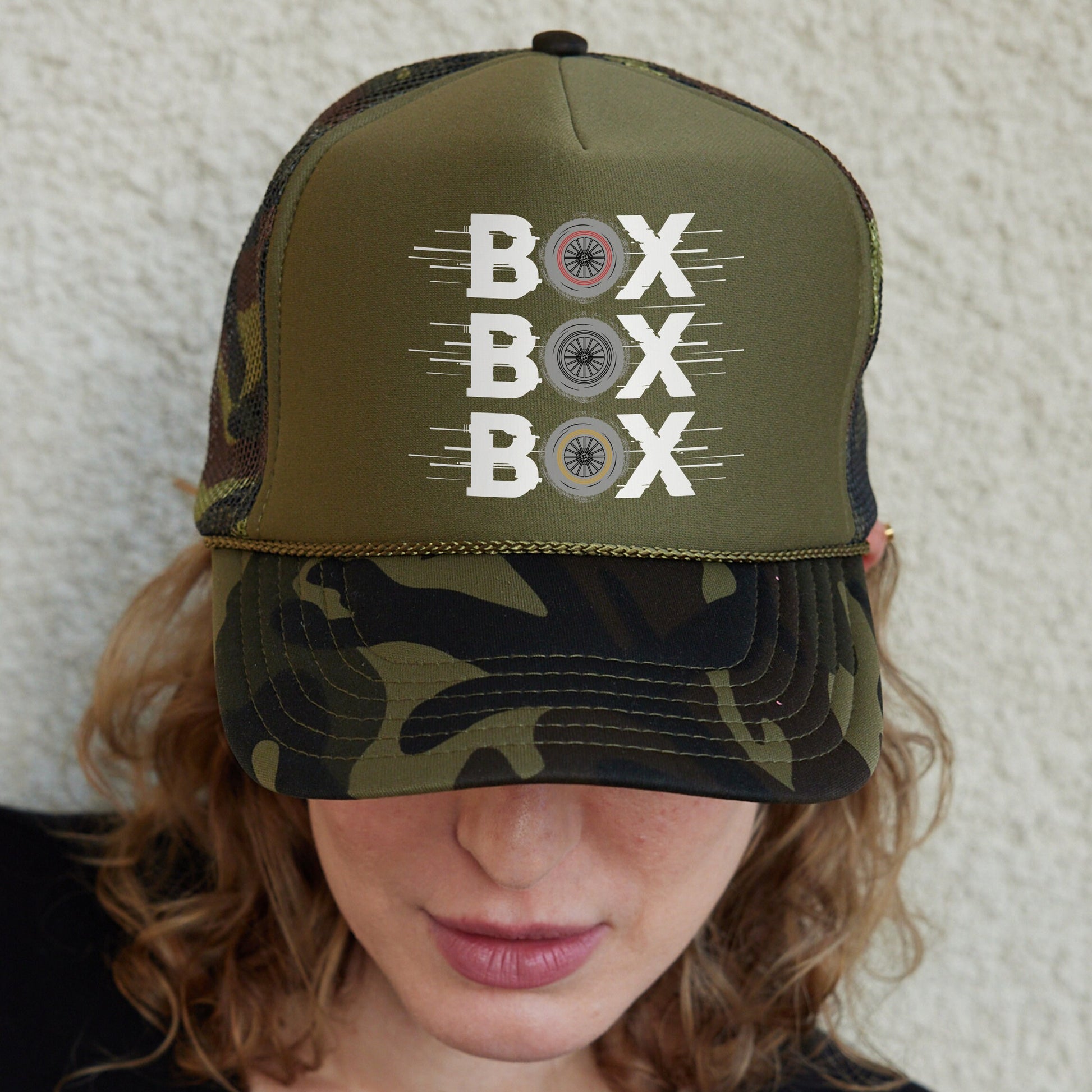 a woman wearing a hat with a box box on it