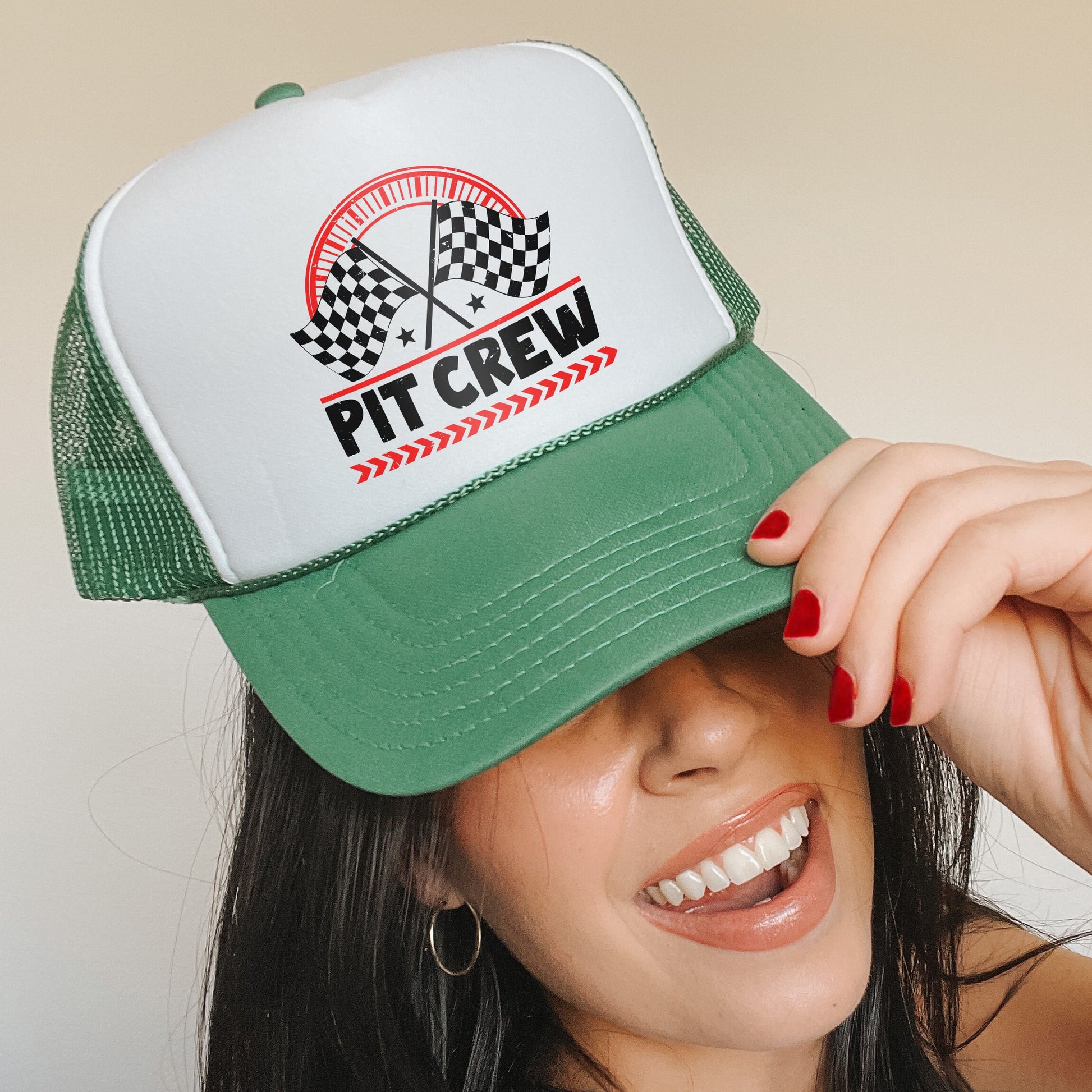a woman wearing a green and white trucker hat