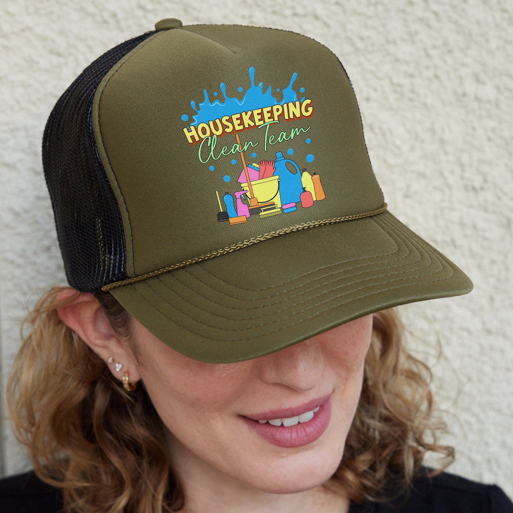 a woman wearing a trucker hat with the words house keeping on it