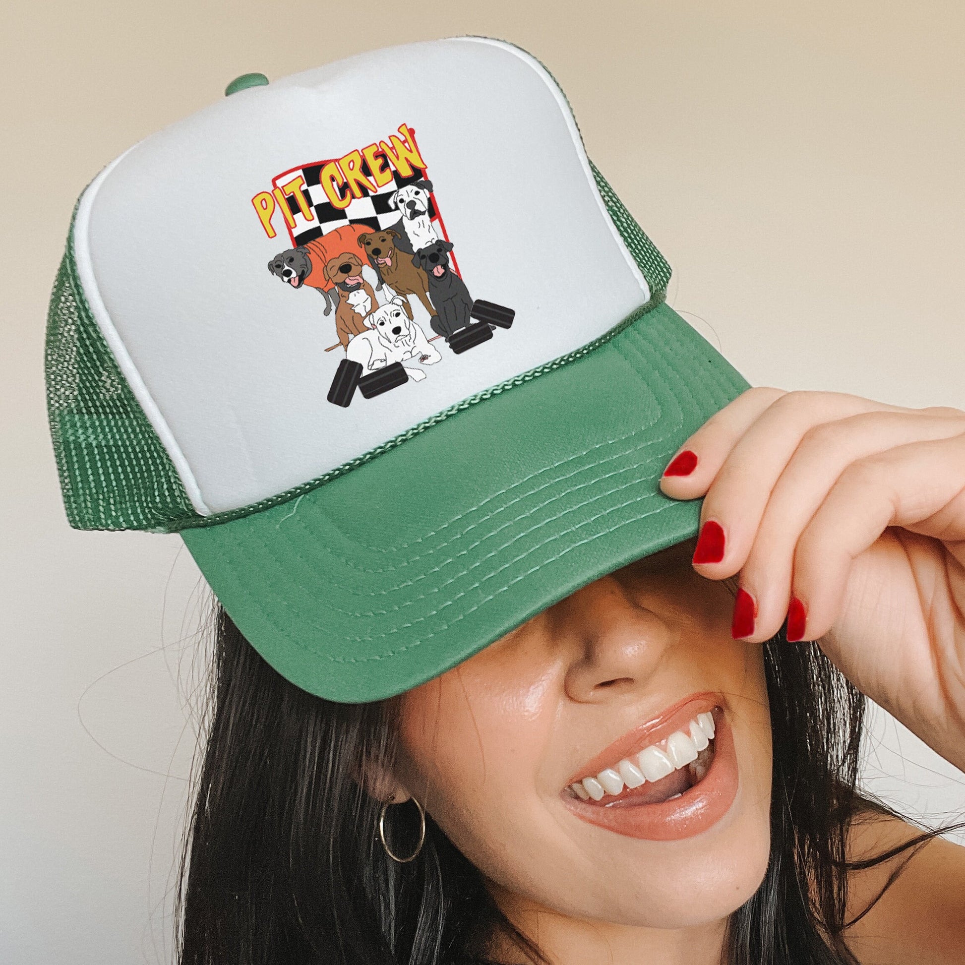 a woman wearing a green and white hat with a picture of a dog on it