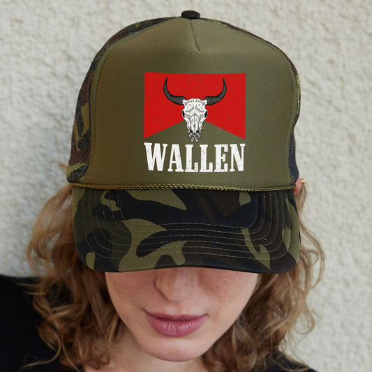 a woman wearing a hat with a bull&#39;s head on it