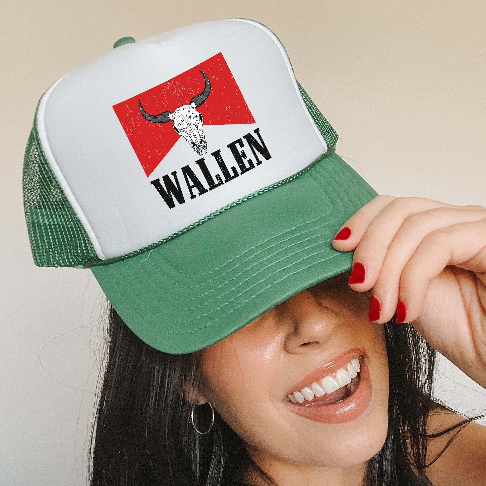 a woman wearing a green and white trucker hat
