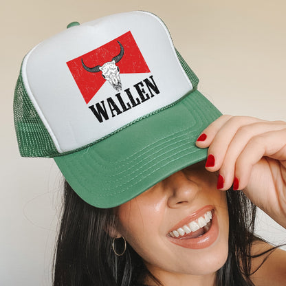 a woman wearing a green and white trucker hat