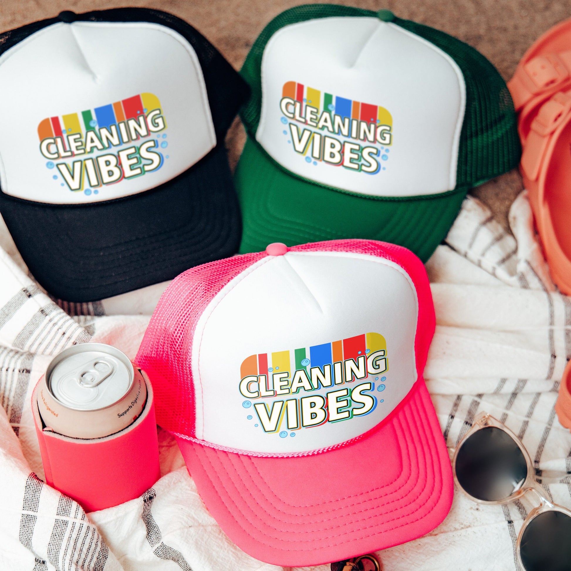 three cleaning vibes hats sitting on top of a towel