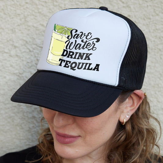 a woman wearing a white and black trucker hat