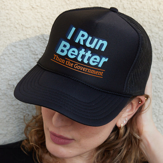 a woman wearing a hat that says i run better than the government