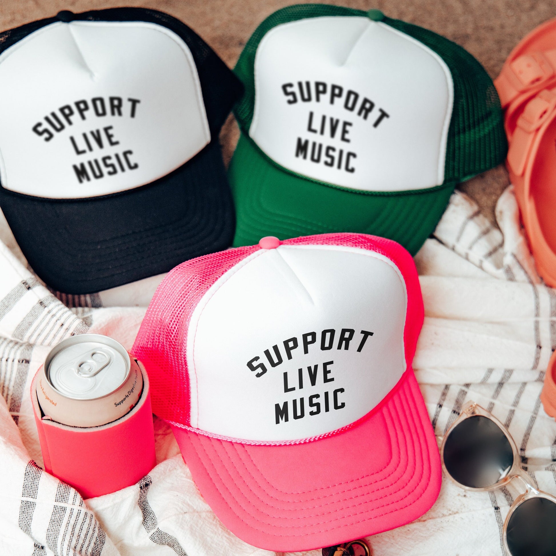 a group of hats sitting on top of a blanket