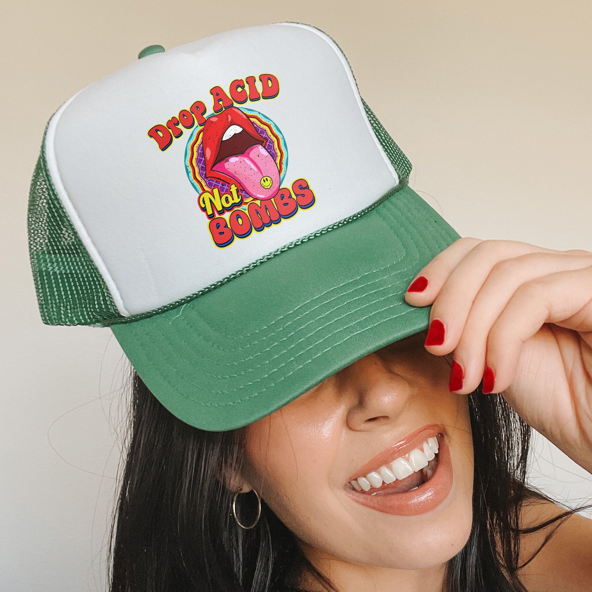 a woman wearing a green and white trucker hat