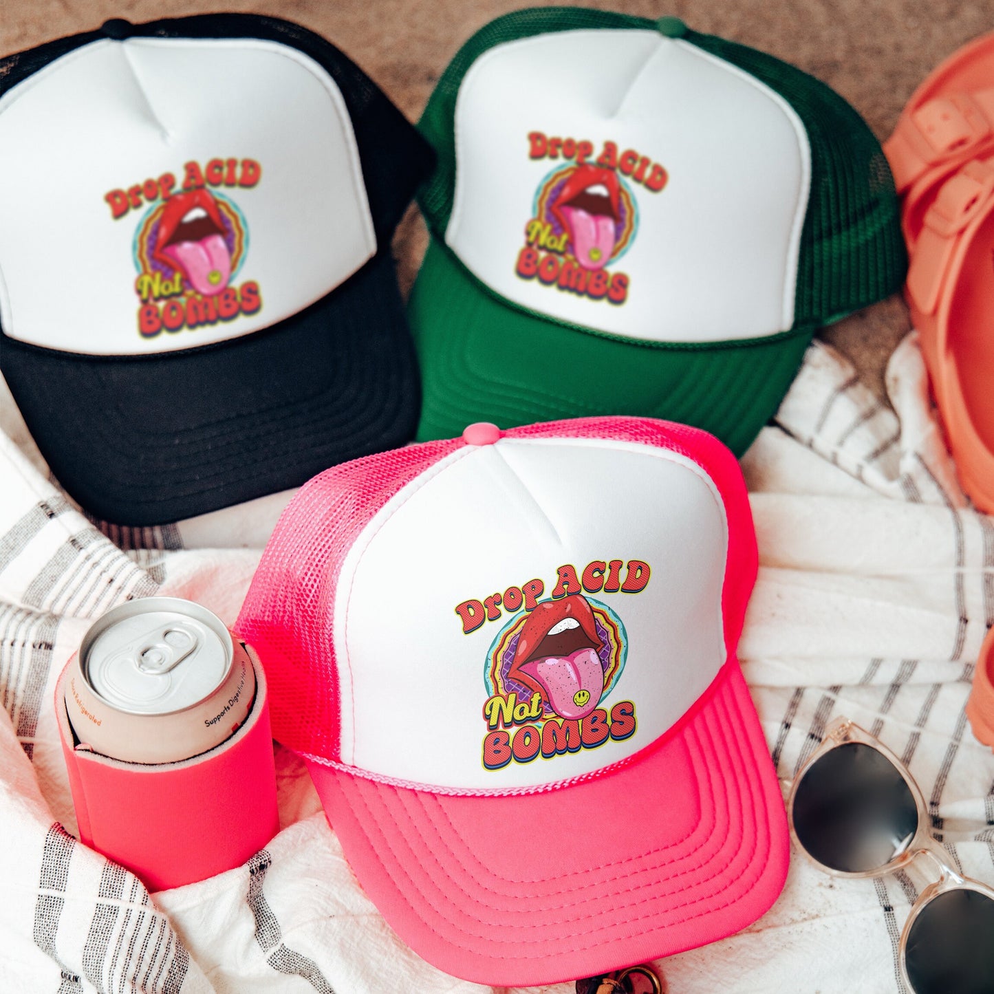 a group of hats and sunglasses on a blanket
