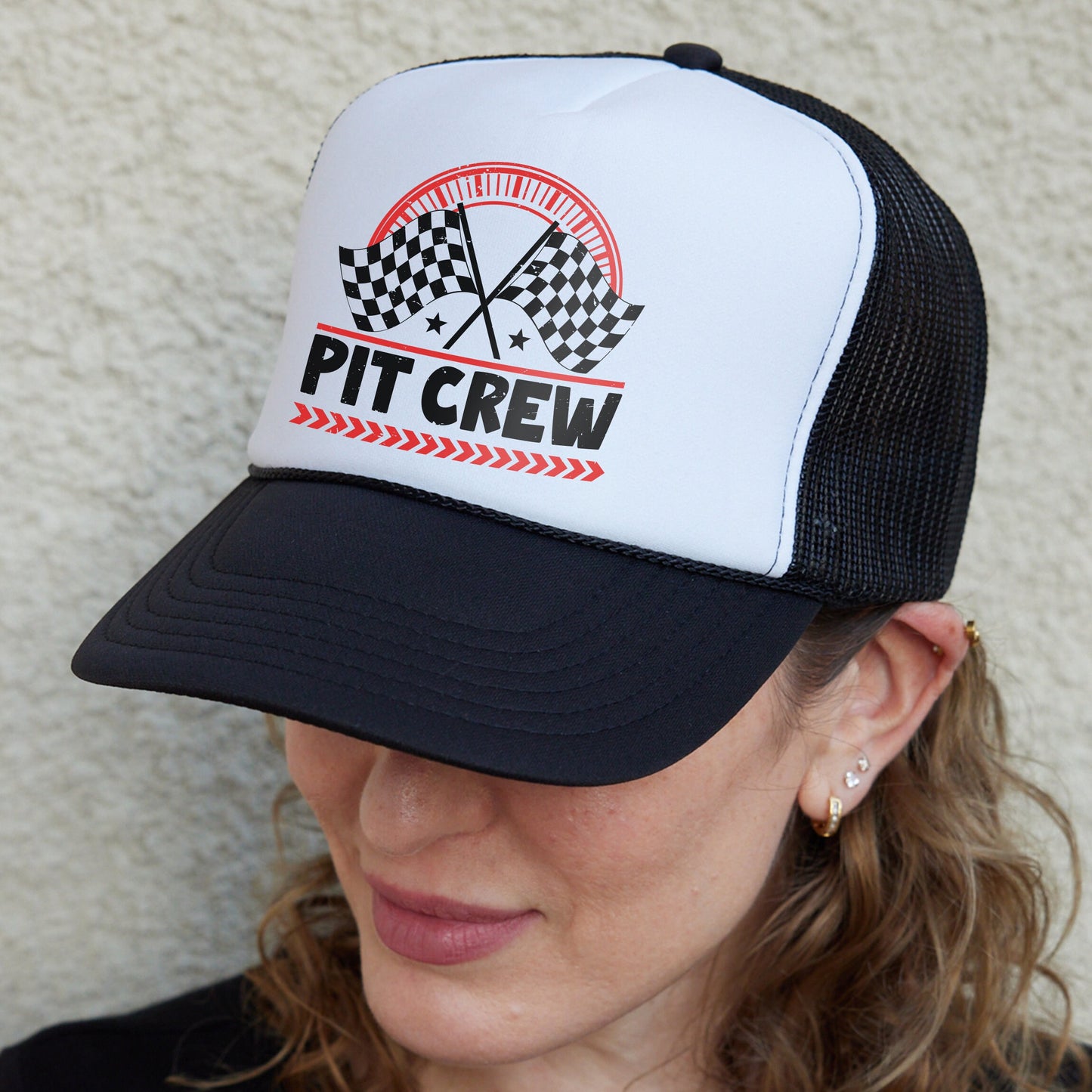 a woman wearing a black and white hat