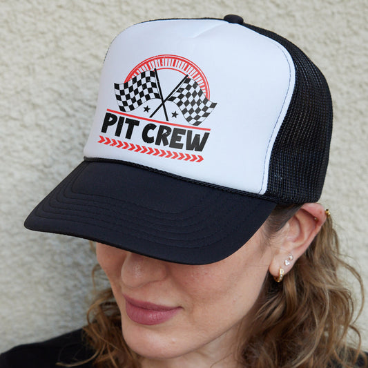 a woman wearing a black and white hat