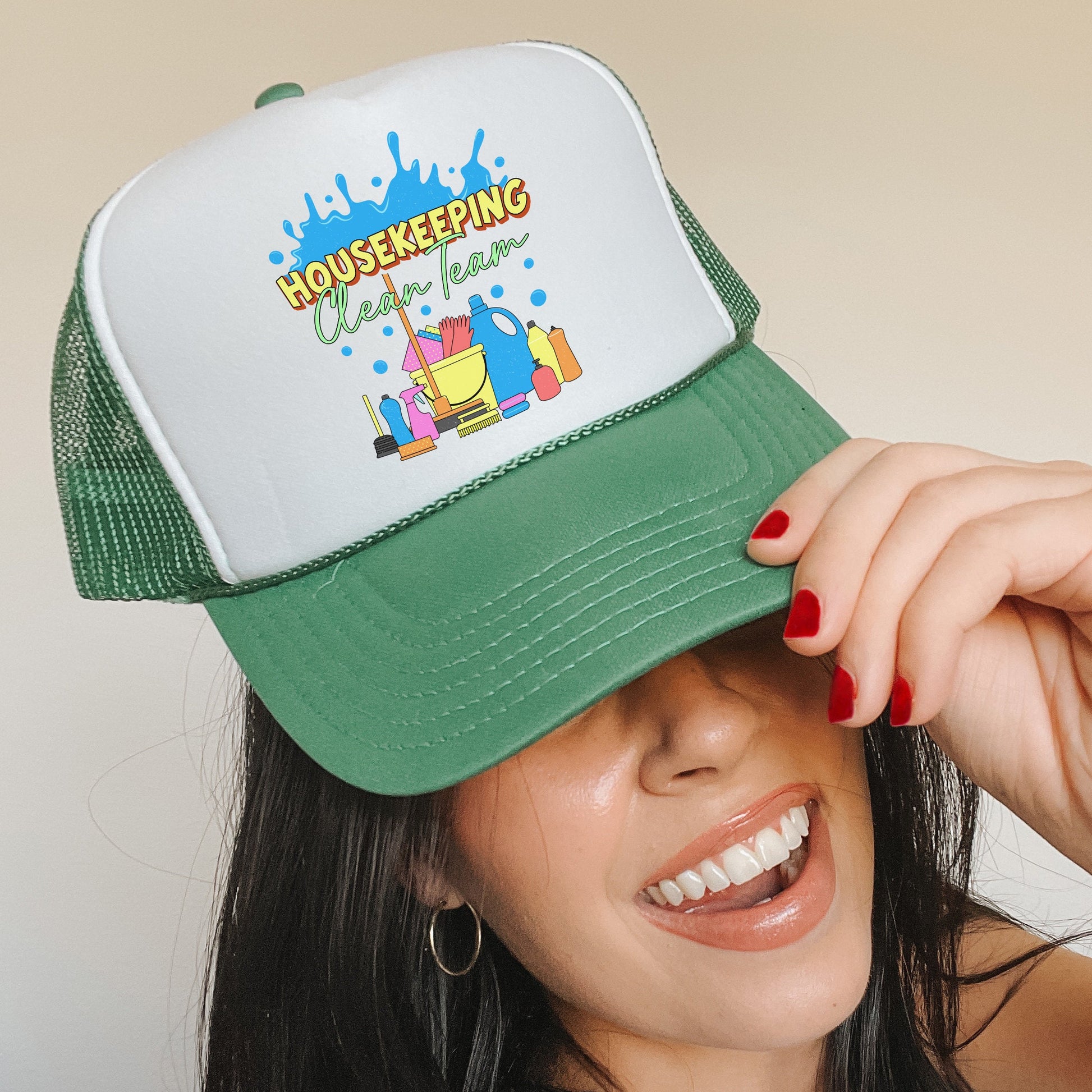 a woman wearing a green and white trucker hat