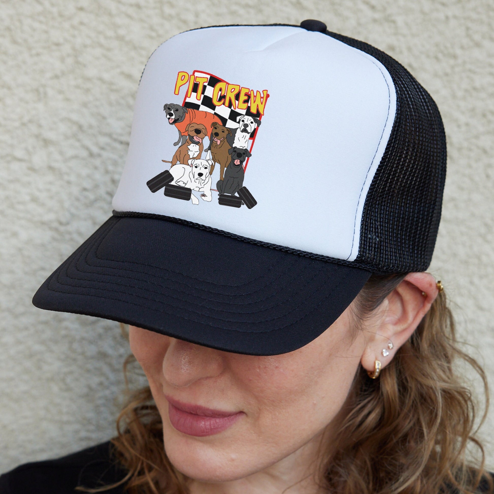 a woman wearing a hat with a picture of a dog on it