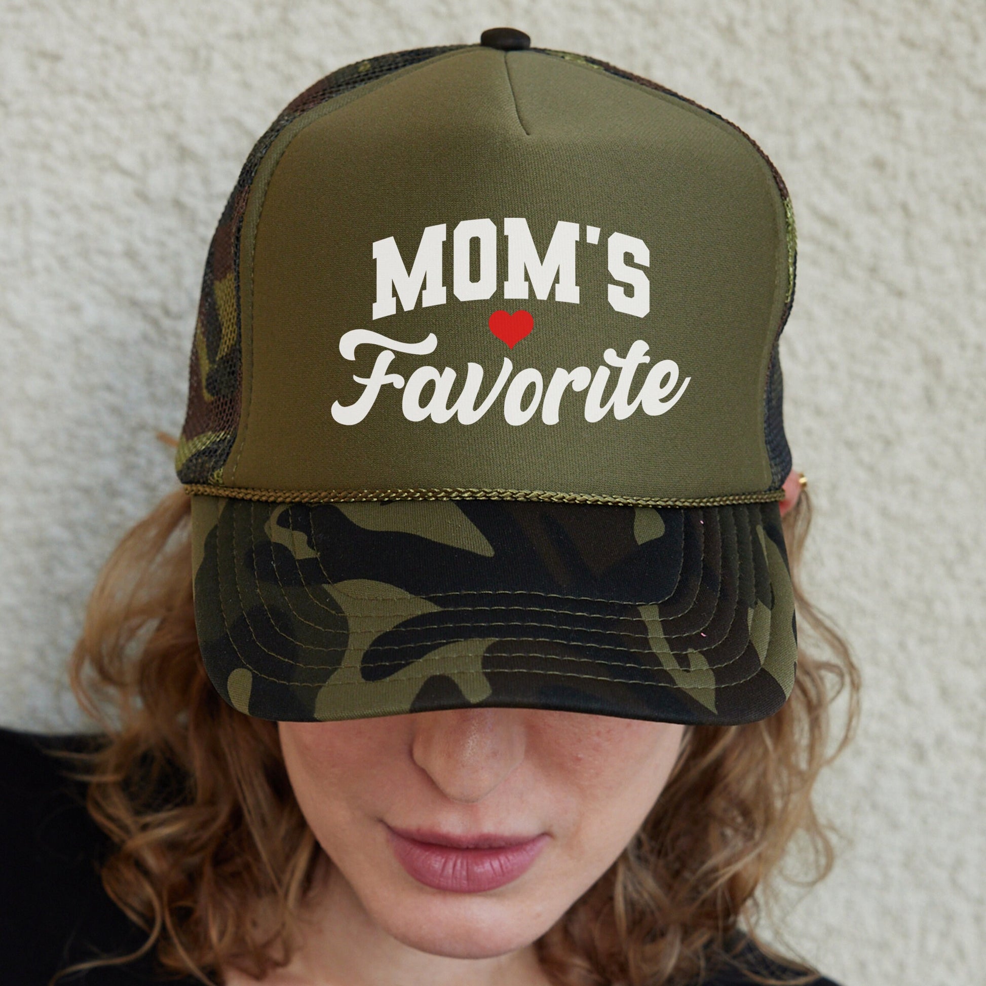 a woman wearing a hat that says mom&#39;s favorite