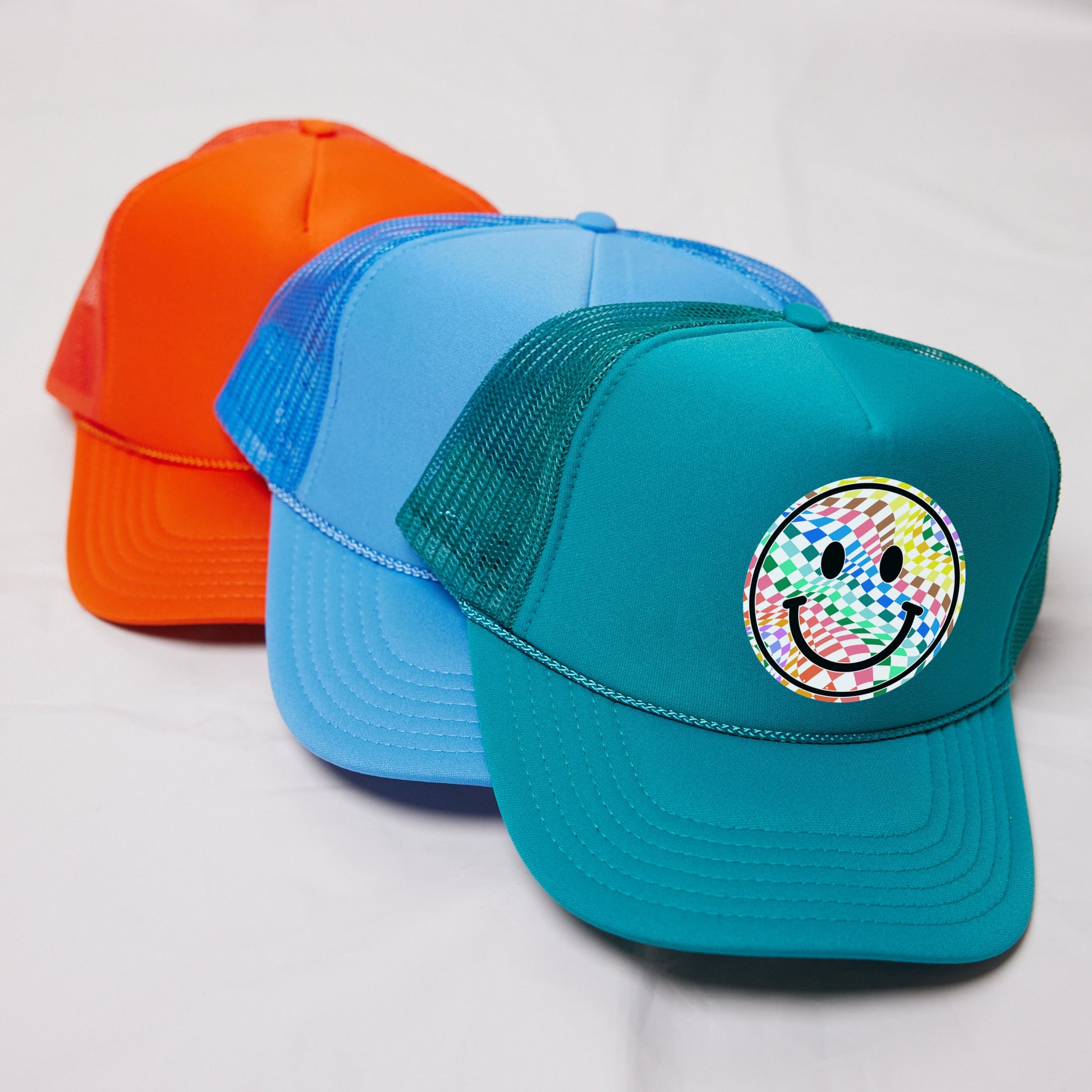 a couple of hats sitting on top of a white table
