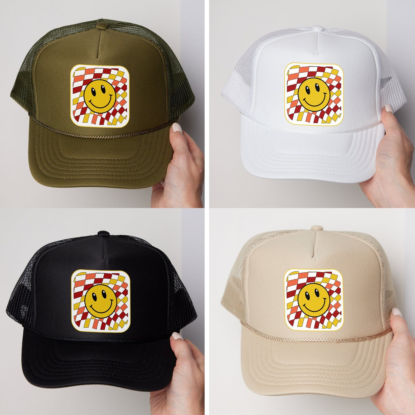 a person holding a hat with a smiley face on it