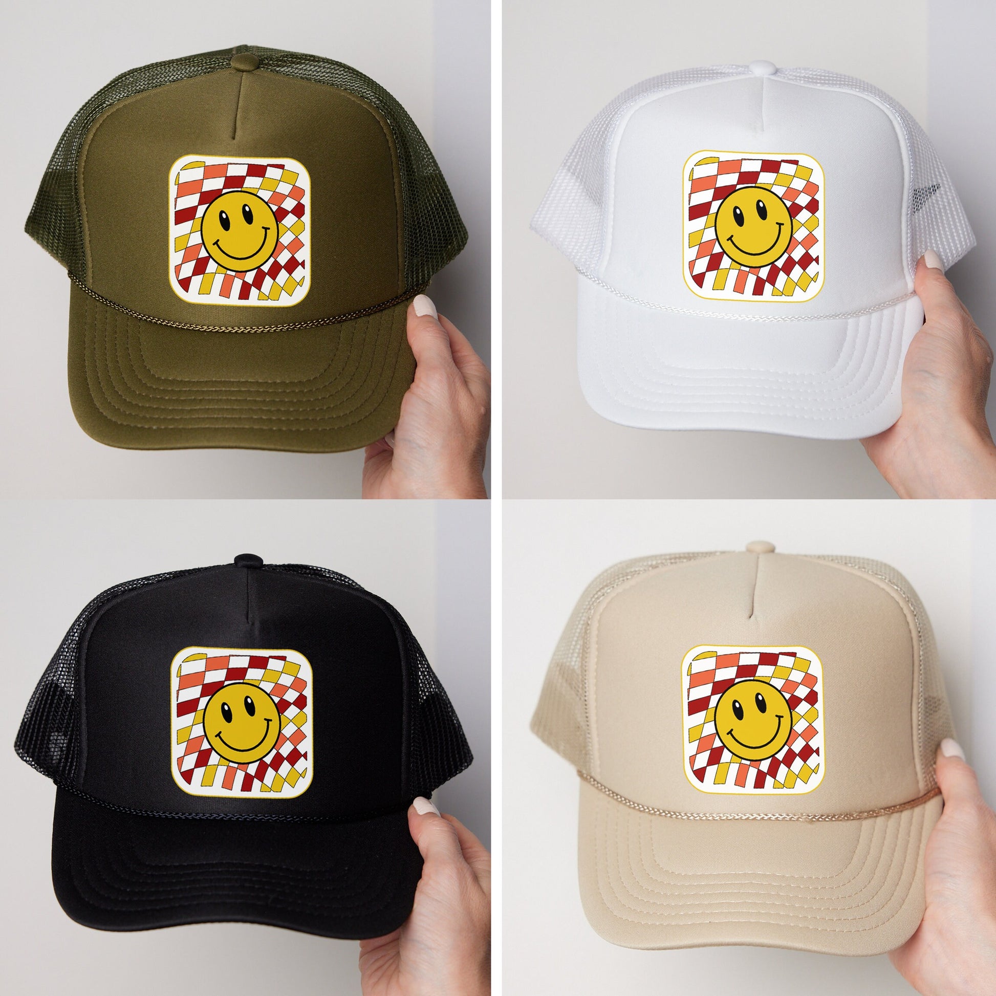 a person holding a hat with a smiley face on it