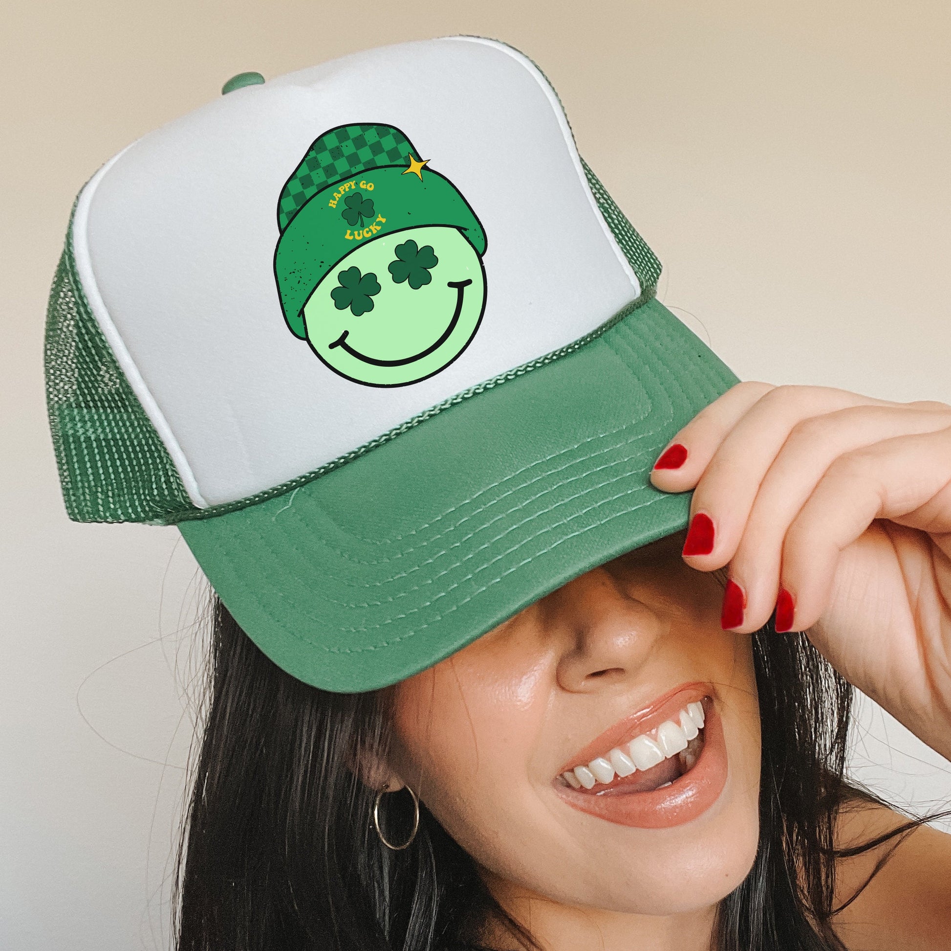 a woman wearing a green hat with a smiling face