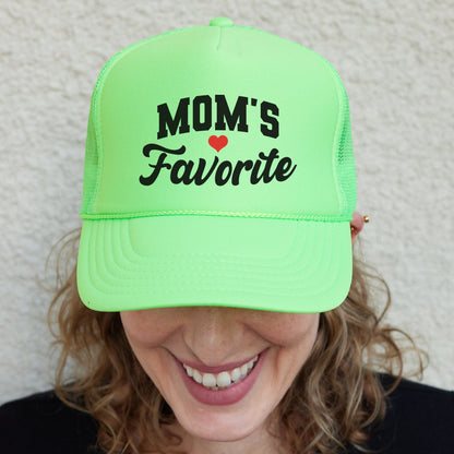 a woman wearing a neon green mom&#39;s favorite hat