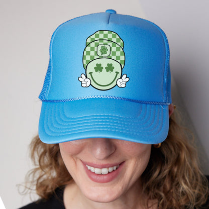 a woman wearing a blue hat with a green smiley face