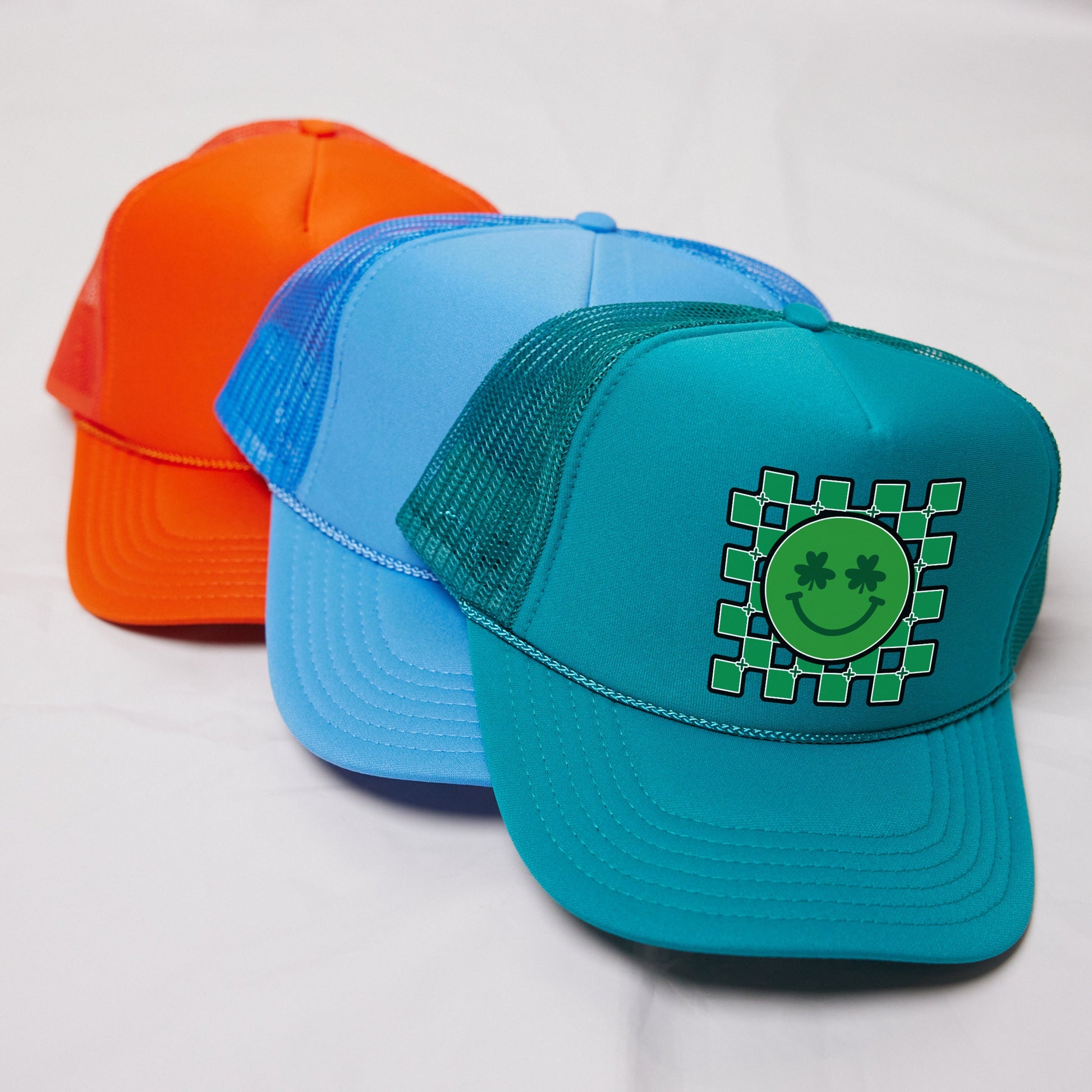 a couple of hats sitting on top of a white table