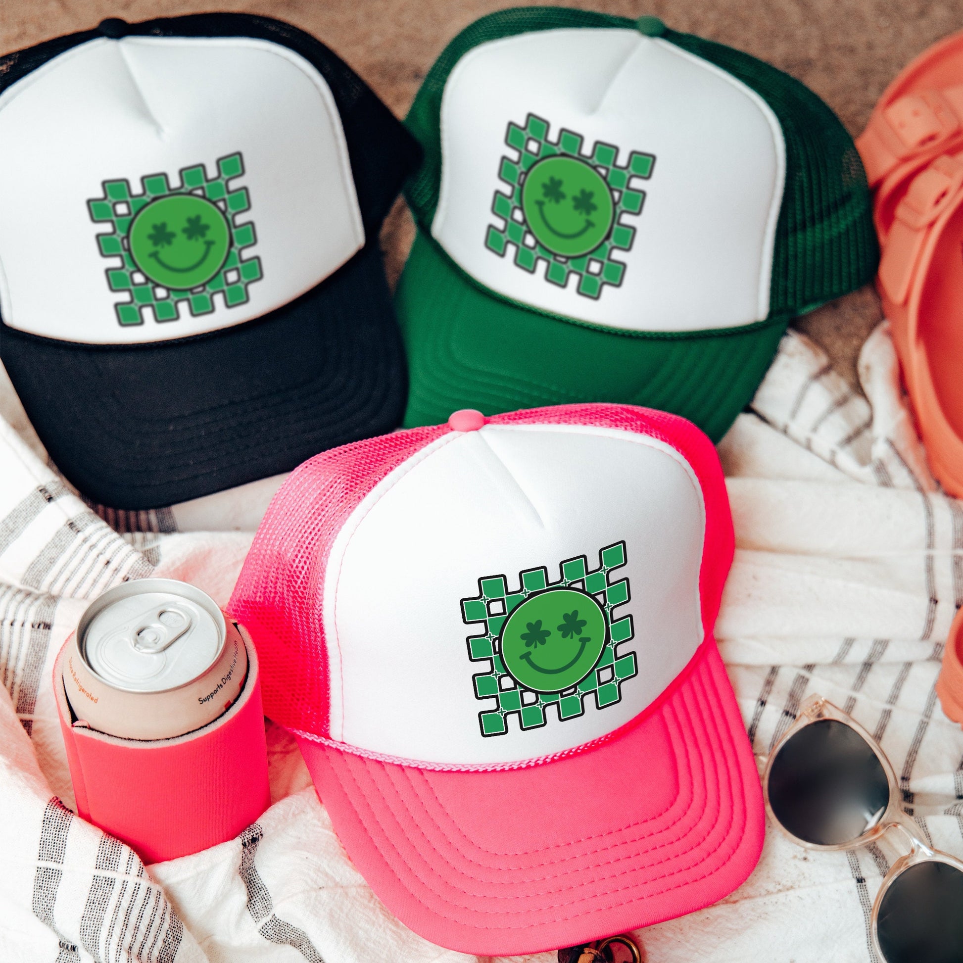 a group of hats sitting on top of a blanket