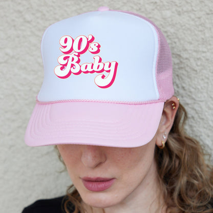 a woman wearing a pink and white 90&#39;s baby hat